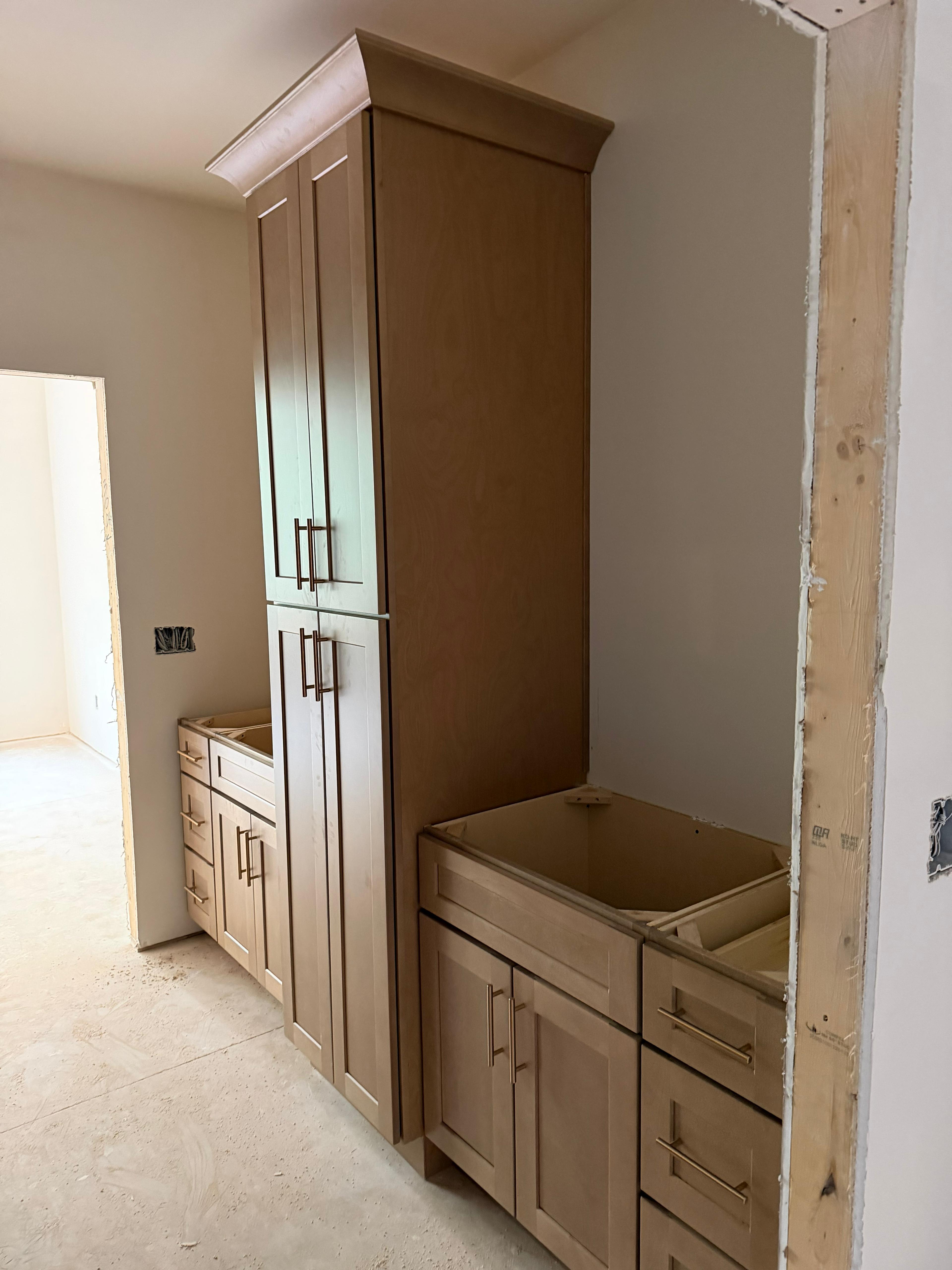 Tall cabinetry and lower storage during installation.